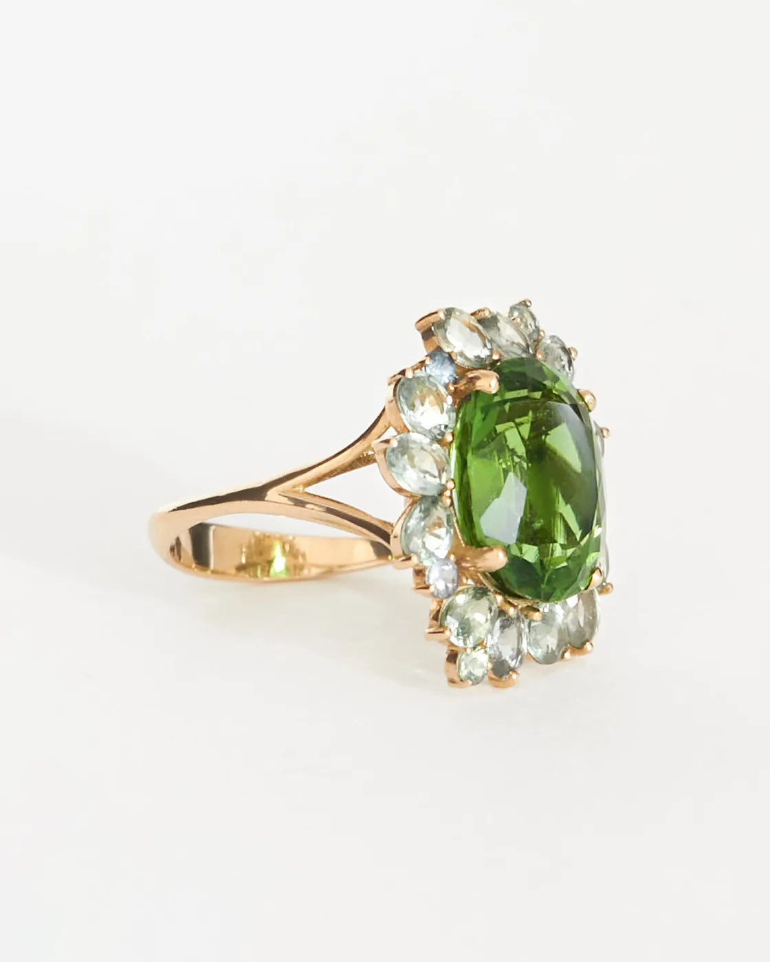 Ring with moldavite and green sapphires